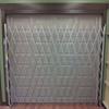 Single gate extended across a garage door.